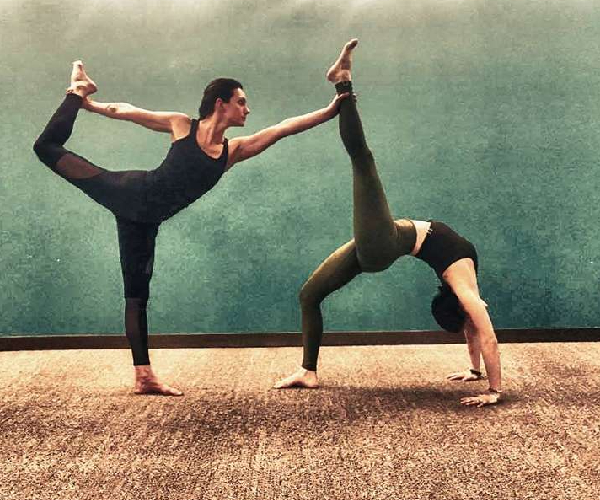 Two Fit Gymnasts Practicing A Complex Yoga Pose. Stock Photo, Picture and  Royalty Free Image. Image 3007658.